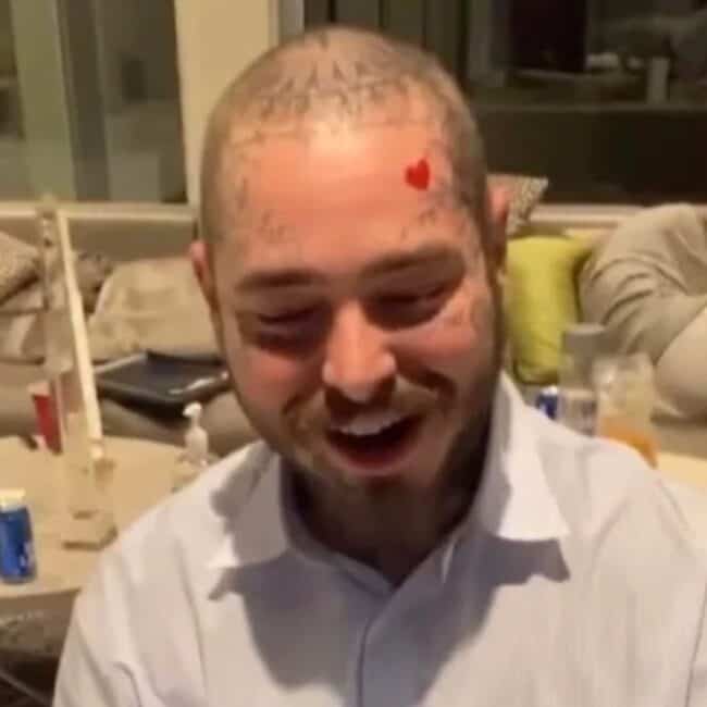 Post Malone Heart Colour Face Tattoo On His Forehead