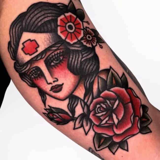 Traditional Colour Nurse Intense Gaze Red Cross Headband Floral Patterns Woman Portrait Arm Tattoo