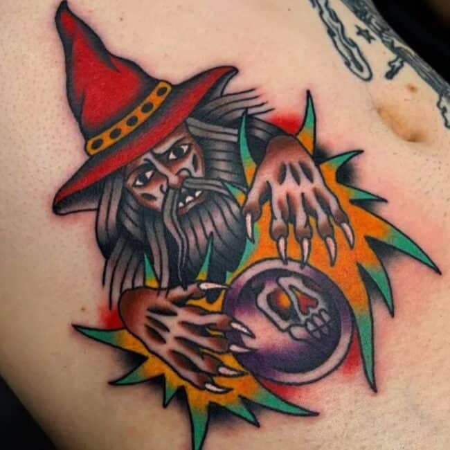 Traditional Colour Wizard Red Hat Crystal Ball Glowing Hands Tattoo