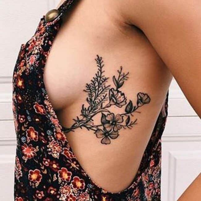 Black and Grey Realism Fine Line Bouquet Flowers Petals Leaves Stems Blooms Node Bud Sternum Rib Tattoo