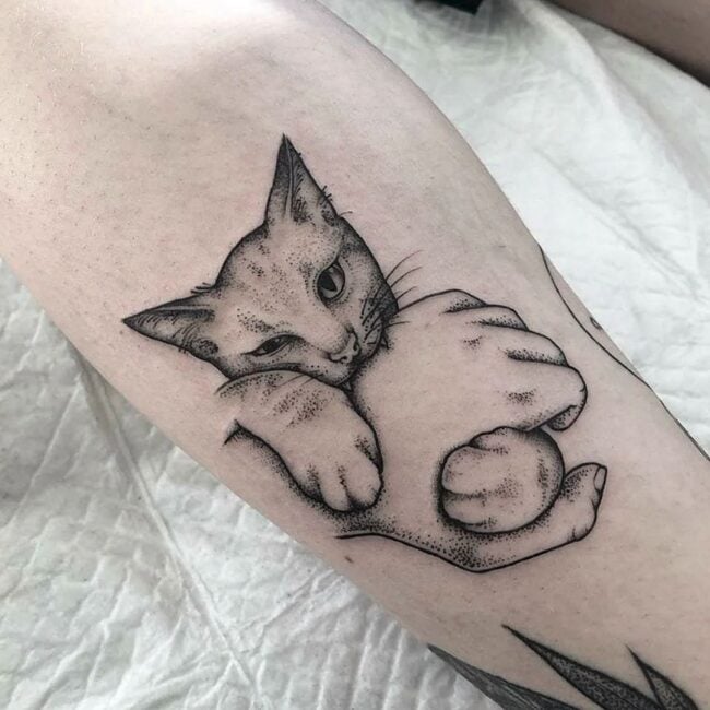 Black and Grey Fine Line Minimalist Cat Biting Human Hand Detailed Eye Nose Whiskers Stop Ears Canine Teeth Leg Calf Tattoo