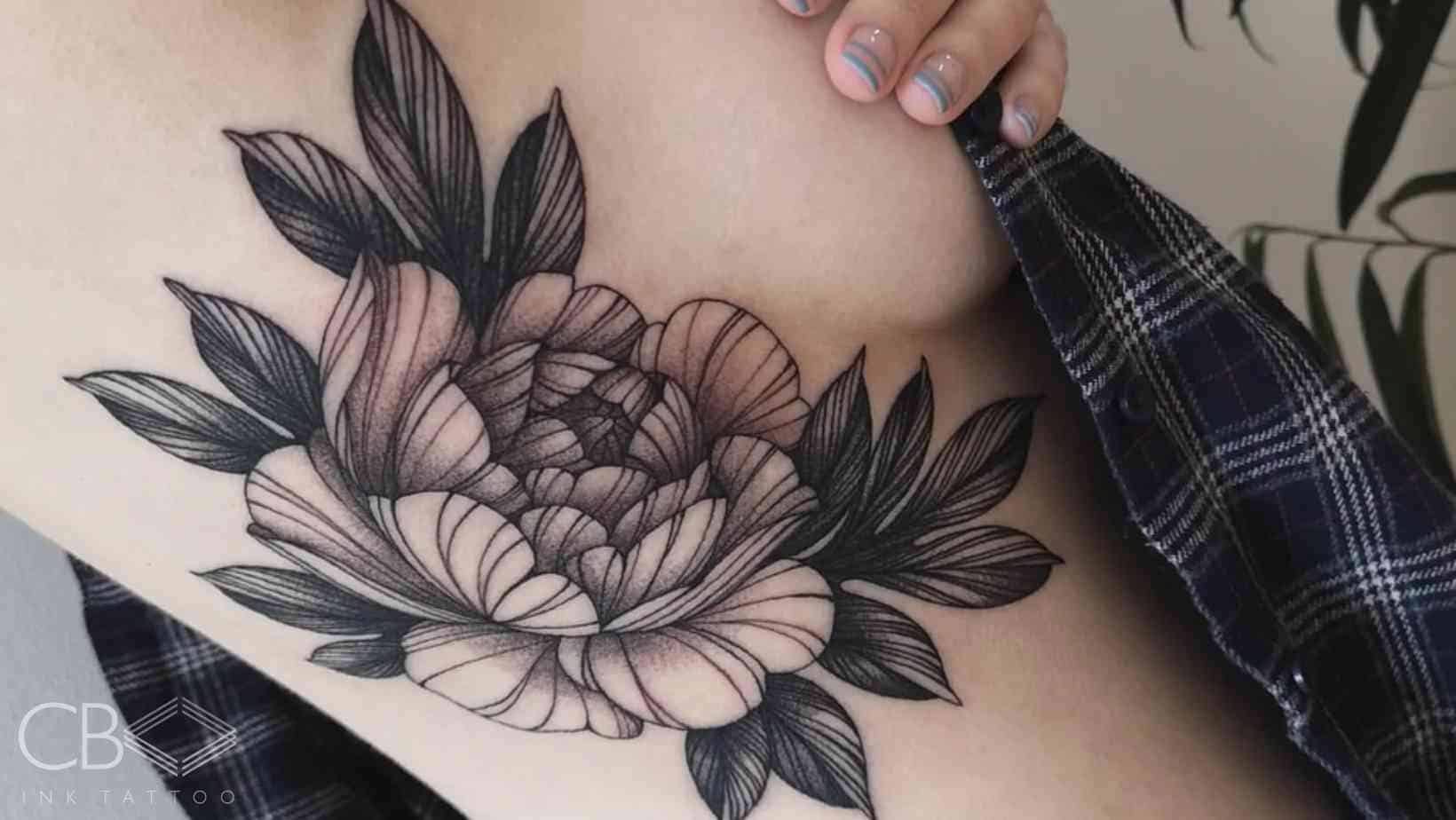 Flowers on Rib Cage Tattoo: Elegant & Bold