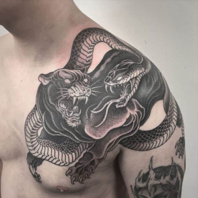 Black and Grey Realism Panther Snake Fighting Sharp Teeth Claws Fangs Tongue Eyes Whiskers Nose Shoulder Chest Tattoo