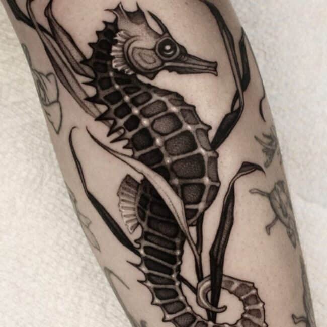 Black and Grey Realism Seahorse Detailed Eye Coronet Fin Keel Snout Tail in Seaweed Forearm Tattoo