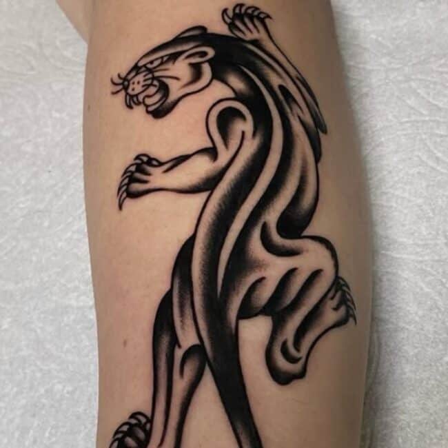 Black and Grey Traditional Fine Line Blackwork Whole Body Panther Detailed Whiskers Sharp Claws Tooth Fierce Eyes Ears Tongue Nose Tail Forearm Tattoo
