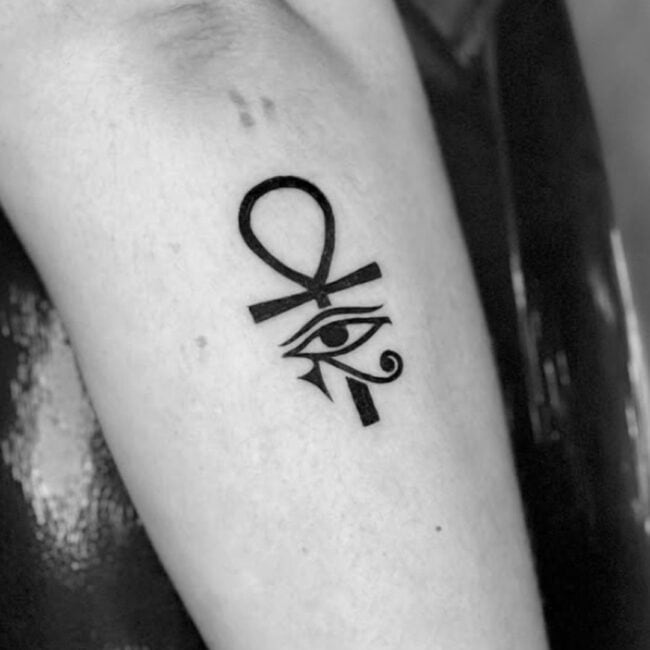 Blackwork Fine Line Minimalist Eye of Horus Ancient Egyptian Symbol Bold Ankh Shaped Cross with Loop Forearm Tattoo