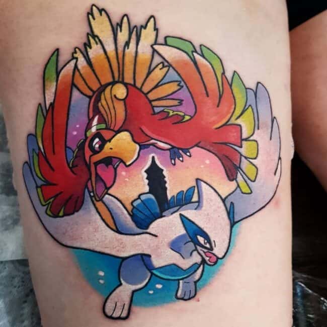 Colour Anime Cartoon Ho Oh Lugia Style Whole Body Flying Detailed and Colourful Wings Feathers Pointed Beak Tongue Large Eyes Tail Fin Black Tower Leg Tattoo