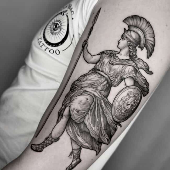 Black and Grey Realism Fine LineAthena Tattoo Roman Warrior Helmet Dress Sandals Spear Shield Arm Tattoo