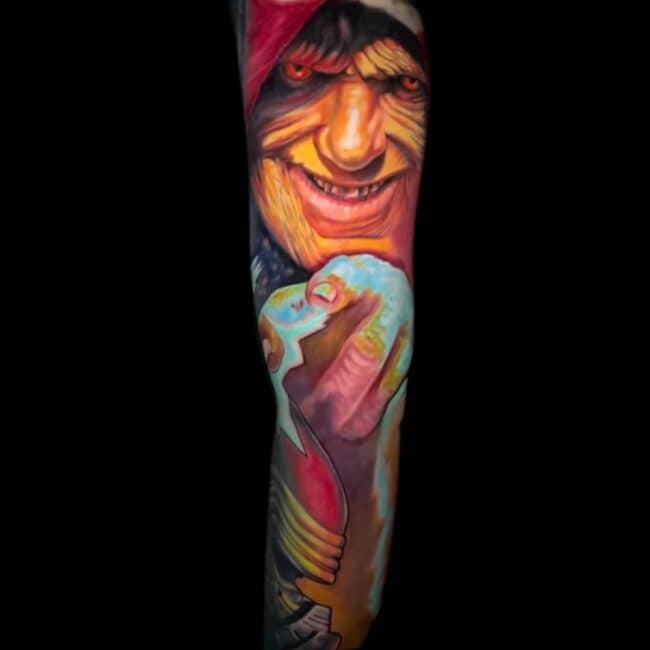 Sunny Tattoo Artist Realism Colour Scary Face Wrinkled Skin Sharp Straight Eyes Pointing the Finger Frightening Smile Arm Sleeve Tattoo