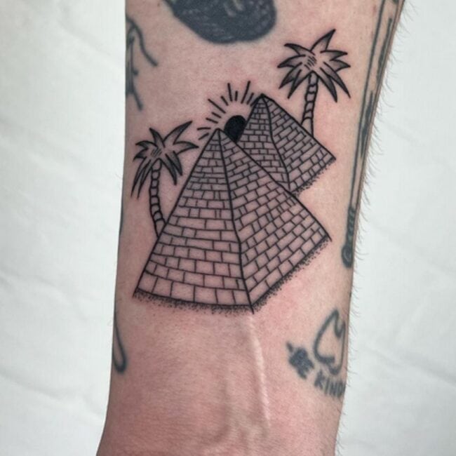 Traditional Black and Grey Fineline Pyramids Bricks Sun Light Shading Palm Trees Sharp Edges Forearm Tattoo