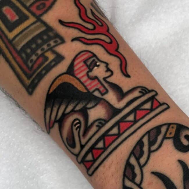 Traditional Colour Geometric Full Body Sphinx Body of Lion Human Head Forearm Tattoo Ancient Egyptian Symbol Eye Nose Lips Wing Forearm Tattoo