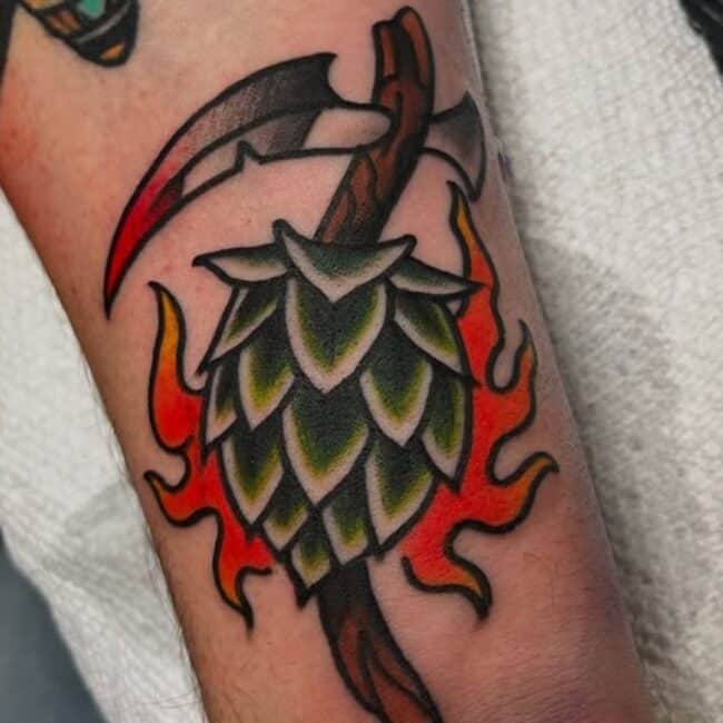 Traditional Colour Hop Cone Pierced Scythe Flames Geometric Lines Shape Edges Forearm Tattoo