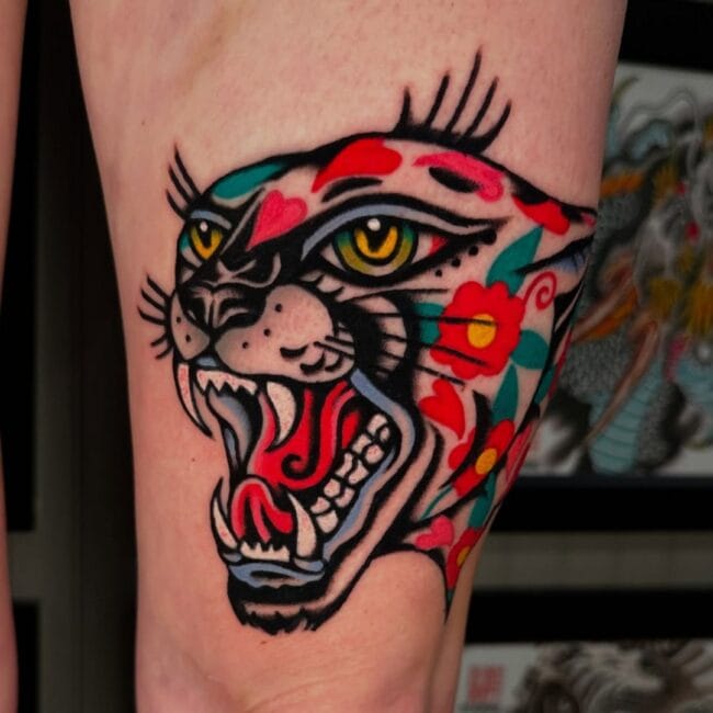 Traditional Colour Portrait Panther Detailed Whiskers Sharp Tooth Fierce Eyes Ears Tongue Nose Hearts Flowers Forearm Tattoo