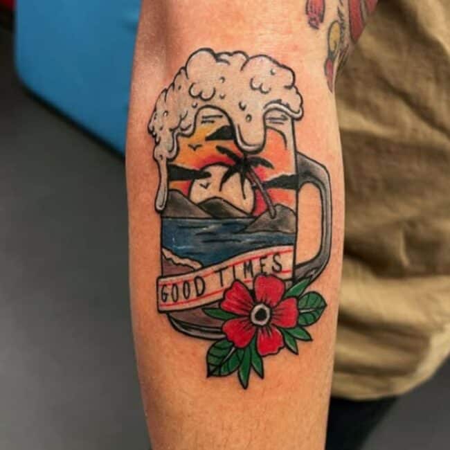 Traditional Script Lettering Cartoon Beer Mug Bubbles Flowing Mountain Birds Sun Ocean Flower Leaves Beach Sand Clouds Forearm Arm Tattoo
