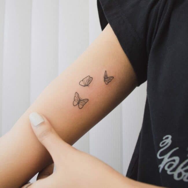 Fine Line Minimalist Black and Grey Whole Body Butterflies Flying Forewings Hindwings Antennae Arm Tattoo