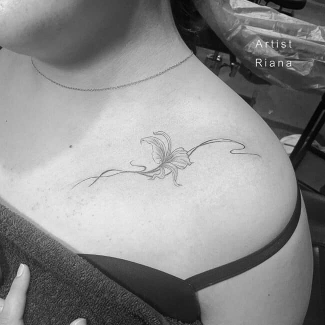 Riana Tattoo Artist Minimalist Fine Line Flower Lily Stem Sketched Pistil Stamen Sepal Peduncle Petal Receptacle Shoulder Chest Tattoo