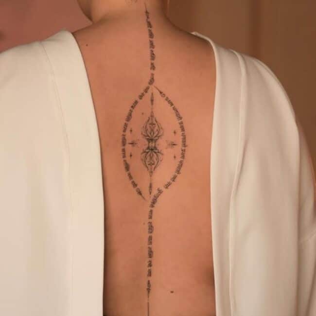 Script Lettering Fine Line Mantras Quotes and Sanskrit Diamonds Stars Straight Cursive Letters Spine Back Tattoo