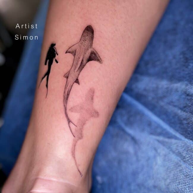 Simon Tattoo Artist Black and Grey Blackwork Diver Lemon Shark Shadow Detailed Fins Tail Diver Oxygen Wetsuits Forearm Tattoo