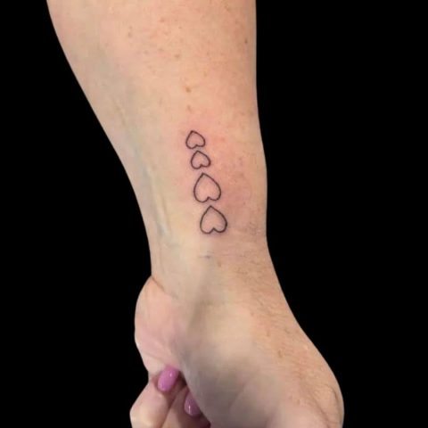 Small Hearts Forearm Tattoo